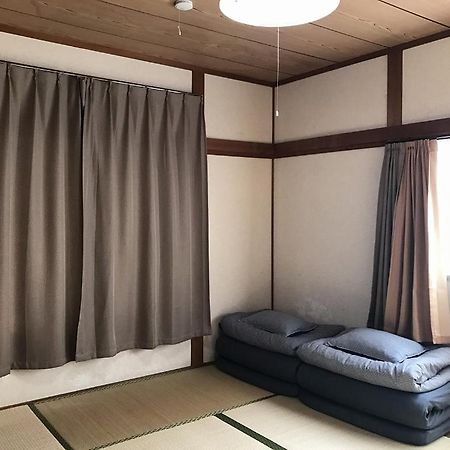 Golden Mile Apartment Amami Bagian luar foto