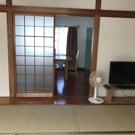 Golden Mile Apartment Amami Bagian luar foto