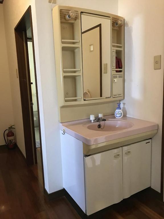 Golden Mile Apartment Amami Bagian luar foto
