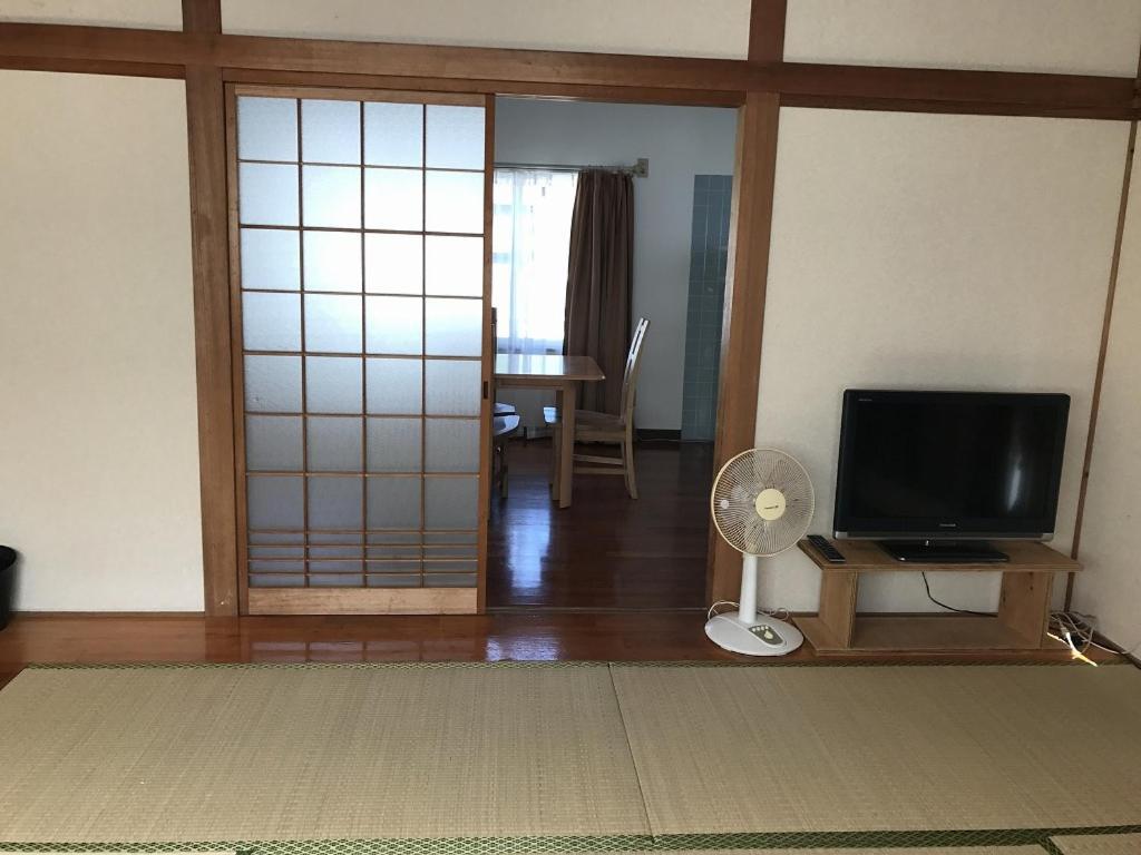 Golden Mile Apartment Amami Bagian luar foto