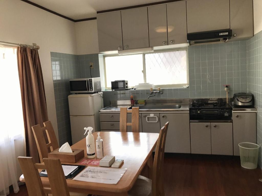 Golden Mile Apartment Amami Bagian luar foto