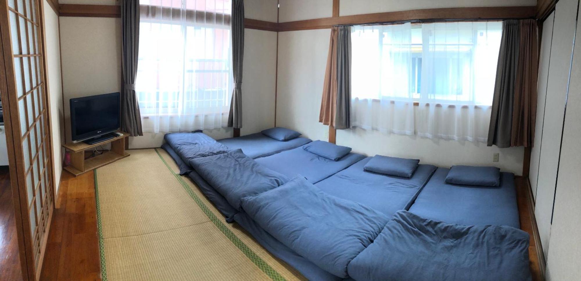 Golden Mile Apartment Amami Bagian luar foto