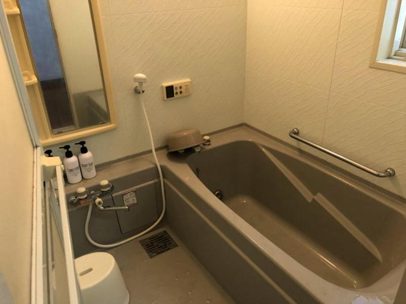 Golden Mile Apartment Amami Bagian luar foto